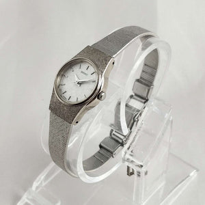 Seiko Women's Petite Watch, Textured Silver Tone Dial, Mesh Strap