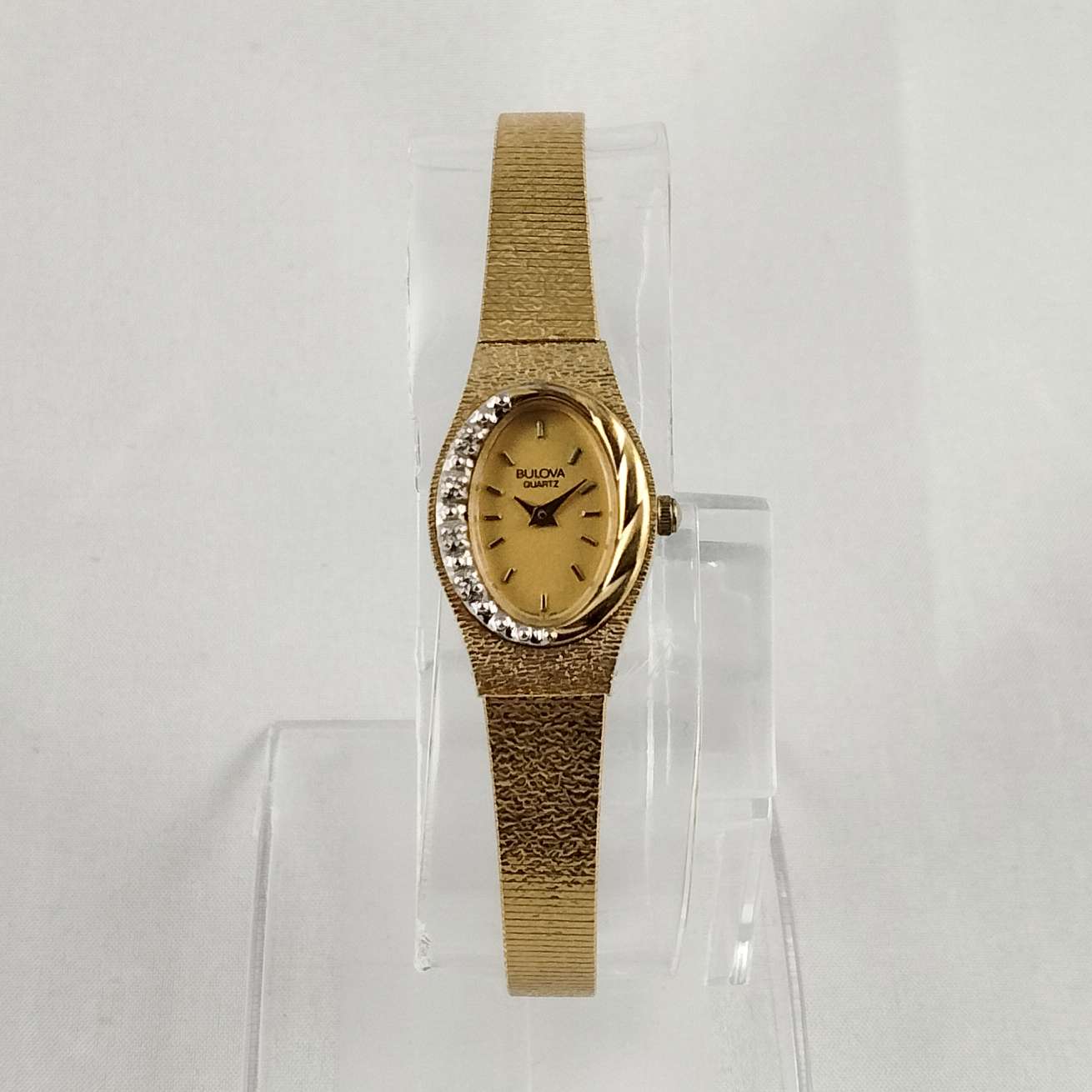 Bulova Quartz Petite Gold Tone Watch, Oval Dial, Asymmetrical Design, Smooth Bracelet Strap