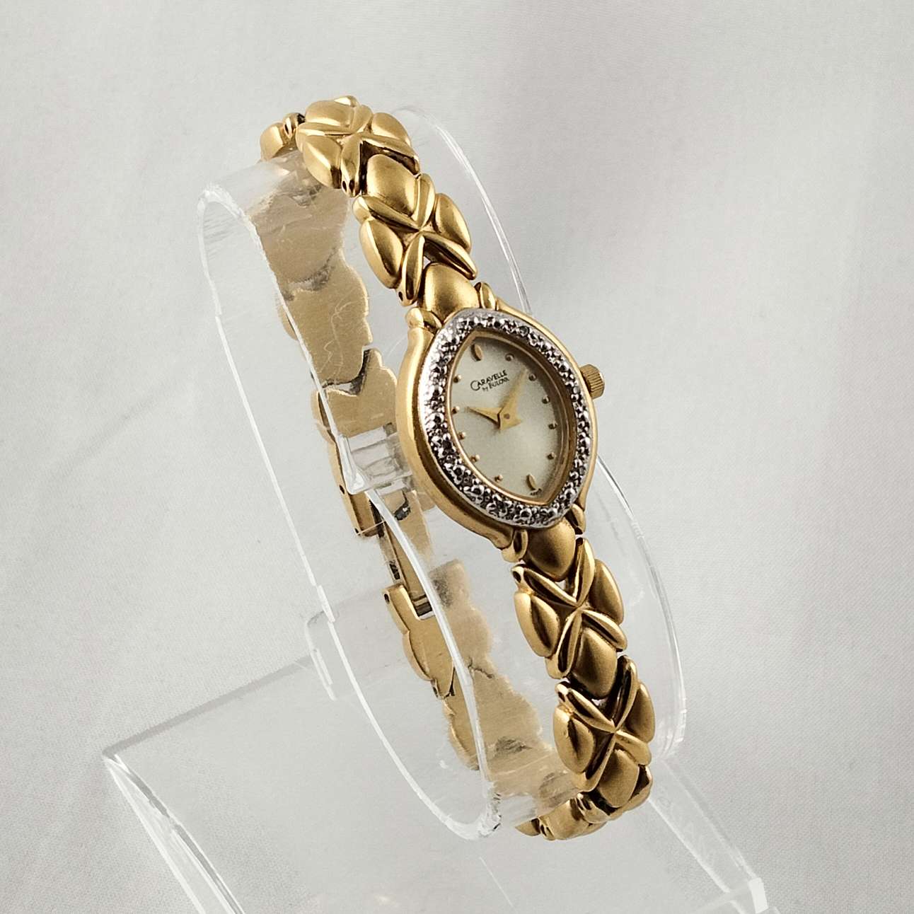 Carvelle by Bulova Gold Tone Women's Watch, Jeweled Oval Dial, Linked Bracelet Strap