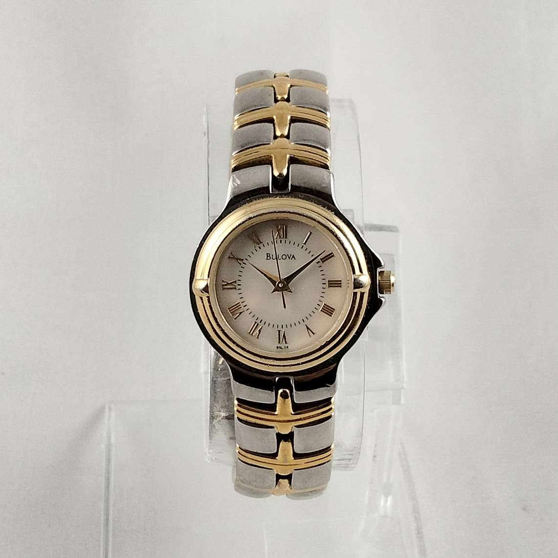 Bulova Silver and Gold Tone Watch, Mother of Pearl Dial, Linked Bracelet Strap