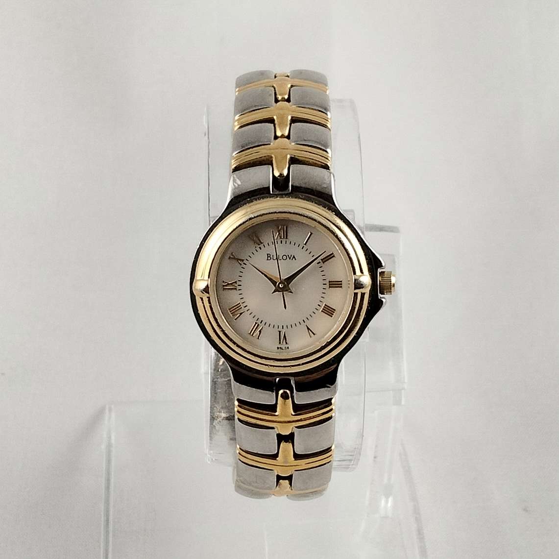 Bulova Silver and Gold Tone Watch, Mother of Pearl Dial, Linked Bracelet Strap