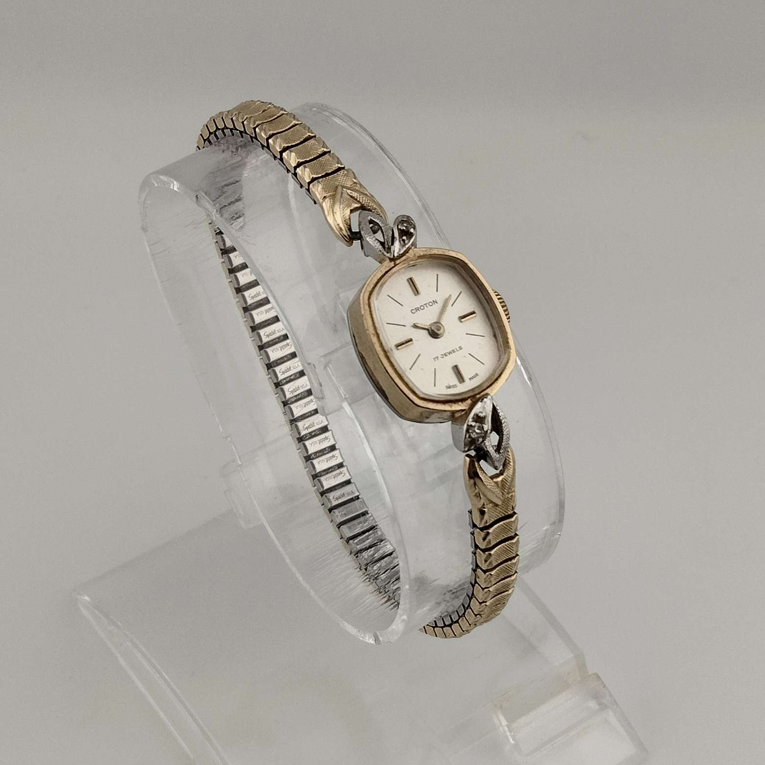 Croton Petite Watch, Gold Tone, Oval Dial, Bezel Leaf Detail, Stretch Strap