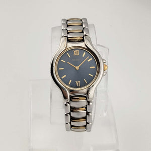 Seiko Petite Silver Tone Watch, Gold Tone Accents, Circular Blue Dial, Bracelet Strap
