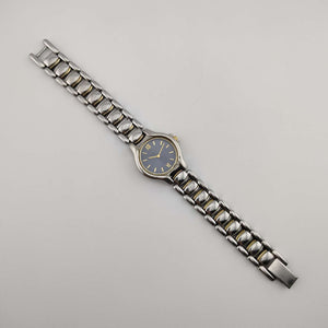 Seiko Petite Silver Tone Watch, Gold Tone Accents, Circular Blue Dial, Bracelet Strap