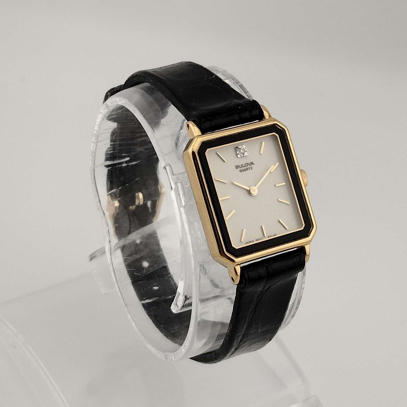 Petite Bulova Watch, White Rectangular Dial, Gold Tone Accents, Black Genuine Leather Strap