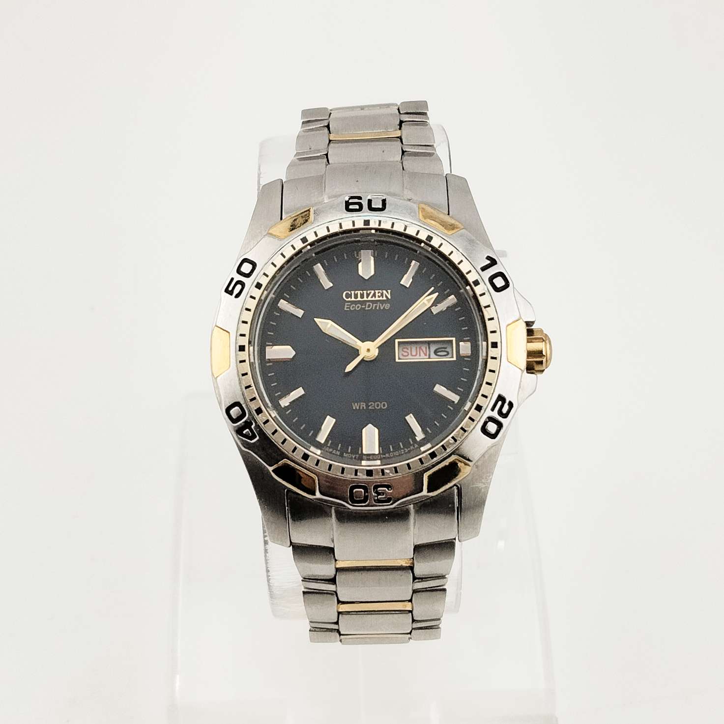 Citizen Men's Silver Tone Eco-Drive Watch, Gold Tone Details, Dark Blue Dial, Date and Day, Bracelet Strap