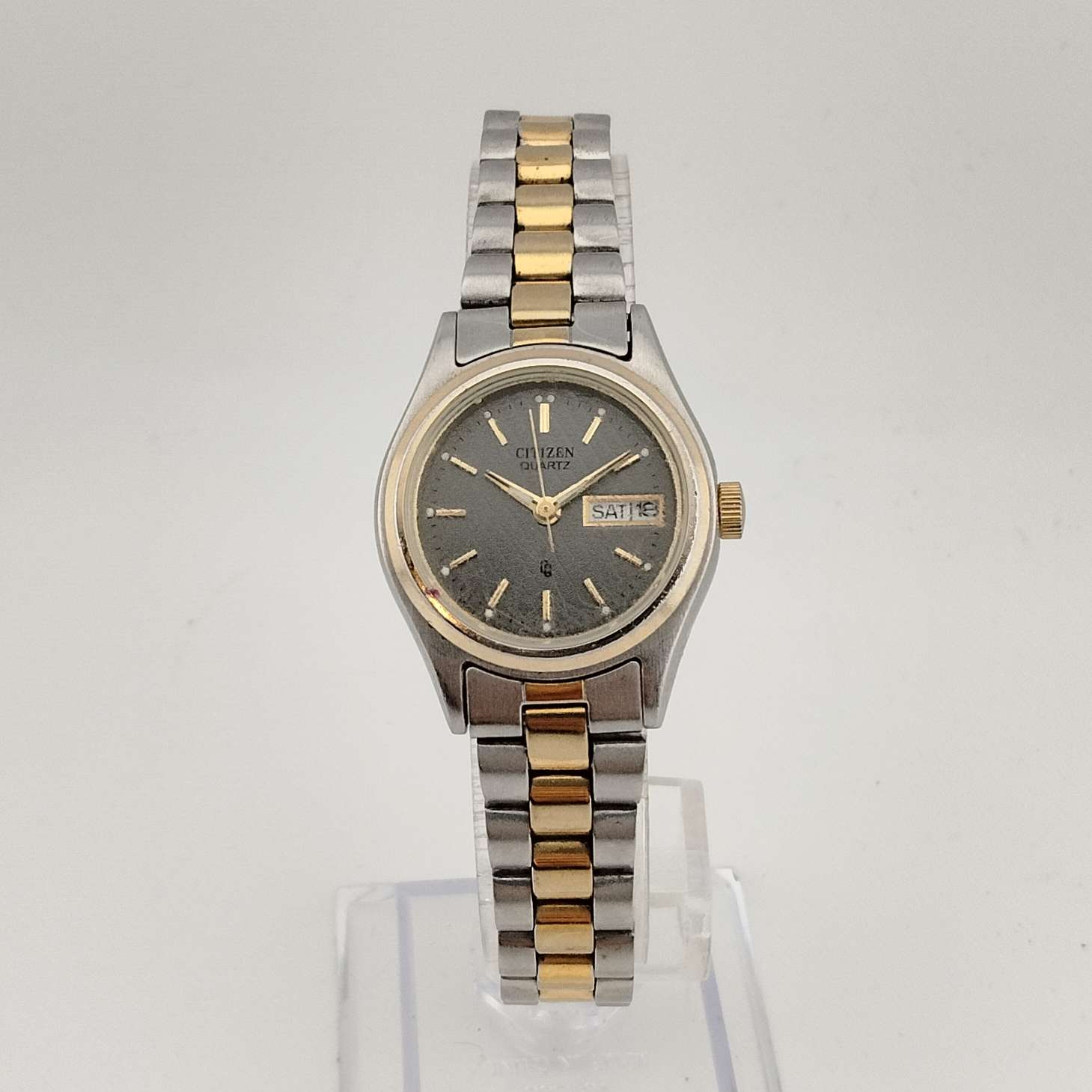 Citizen Men's Silver Tone Quartz Watch, Gold Tone Accents, Round Grey Dial, Date and Day Window, Bracelet Strap