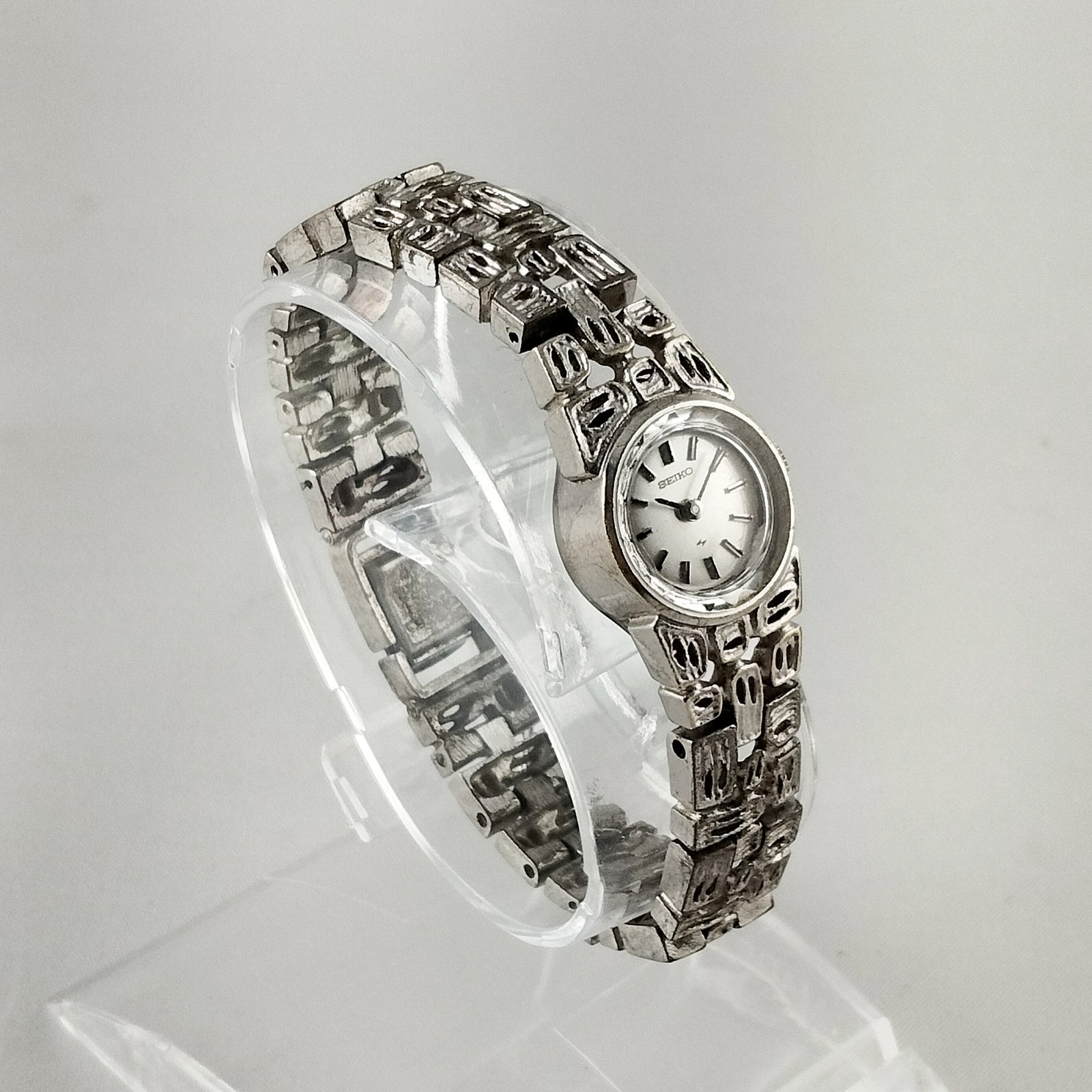 Seiko Women's Petite Silver Tone Watch, Wind Up, Faceted Details, Unique Bracelet Strap