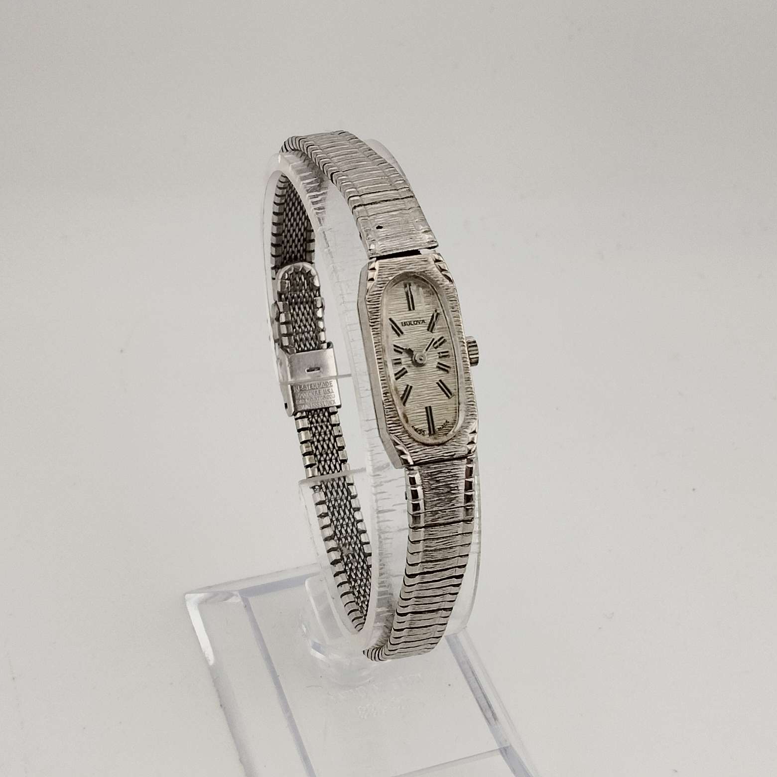 I Like Mikes Mid Century Modern Watches Bulova Women's  Petite Silver Tone Watch, Elongated Oval Dial, Stripe Patterning, Adjustable Bracelet Strap