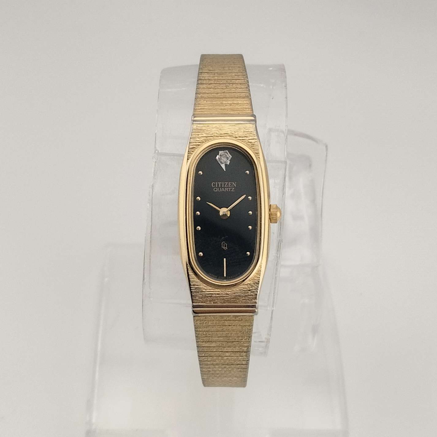 I Like Mikes Mid Century Modern Watches Citizen Petite Quartz, Gold Tone Watch, Elongated Black Oval Dial, Jewel Detail, Bracelet Strap