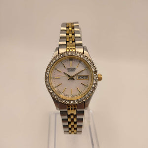 I Like Mikes Mid Century Modern Watches Citizen Women's Mixed Metal Round Watch,  Silver Tone Face, Mother of Pearl Dial with Gold Tone Accents, Bejeweled Bezel,  Mixed Metal Link Strap