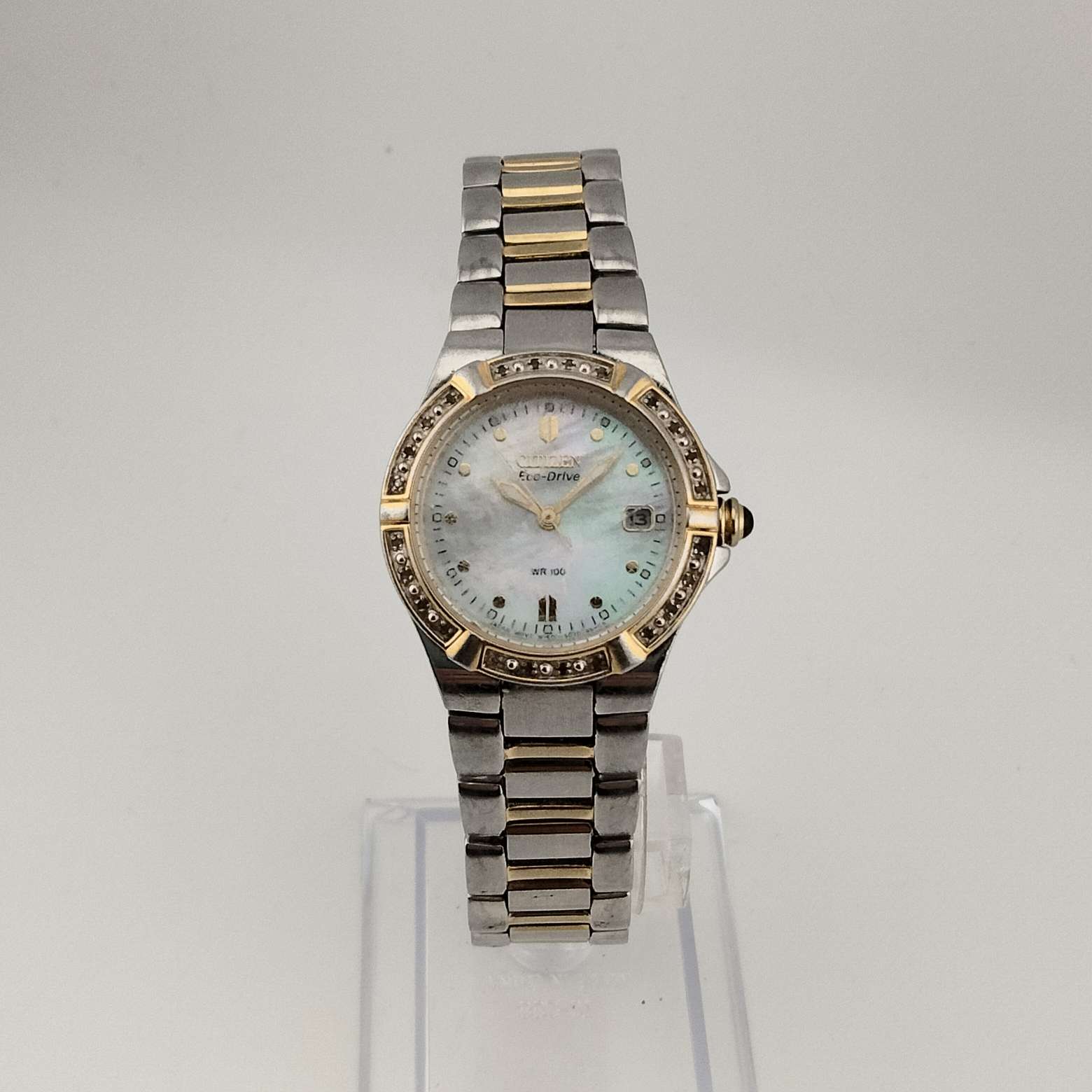 I Like Mikes Mid Century Modern Watches Citizen Women's Silver Tone Eco-Drive Watch, Mother of Pearl Dial, Jeweled Bezel, Date Window, Bracelet Strap