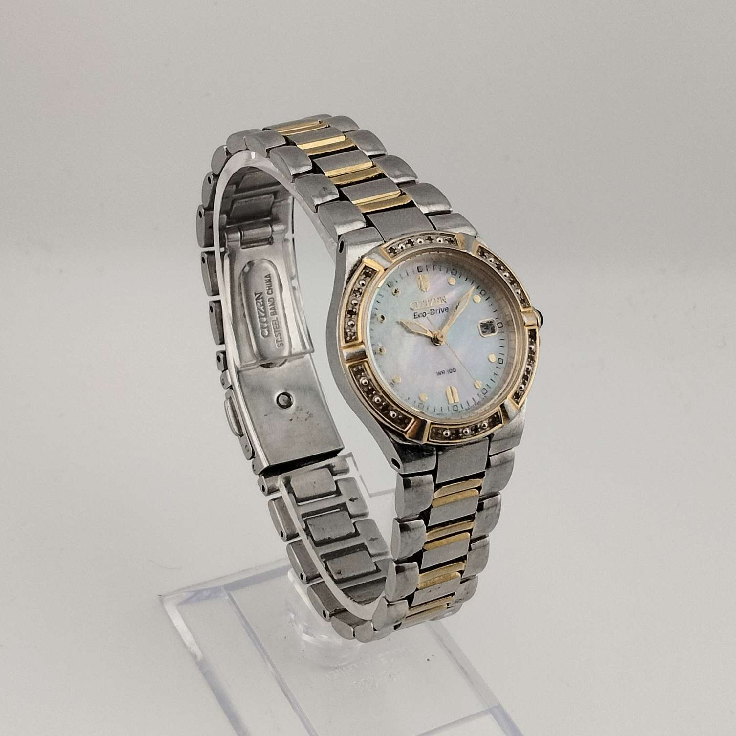 I Like Mikes Mid Century Modern Watches Citizen Women's Silver Tone Eco-Drive Watch, Mother of Pearl Dial, Jeweled Bezel, Date Window, Bracelet Strap