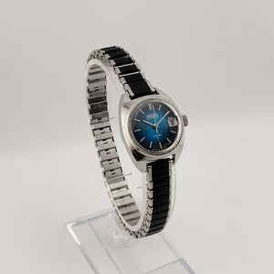 I Like Mikes Mid Century Modern Watches Seiko Silver Tone Automatic Watch, Circular Blue Dial, Date Window with Magnifying Detail, Stretch Strap