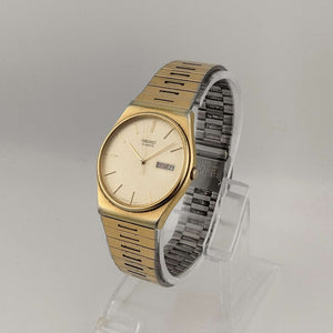 I Like Mikes Mid Century Modern Watches Seiko Unisex Gold Tone Quartz Watch, Circular Dial, Date and Day Window, Adjustable Link Strap