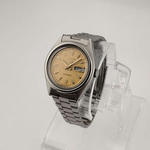 I Like Mikes Mid Century Modern Watches Seiko Unisex Silver Tone Watch, Circular Gold Tone Dial, Date and Day Window, Bracelet Strap