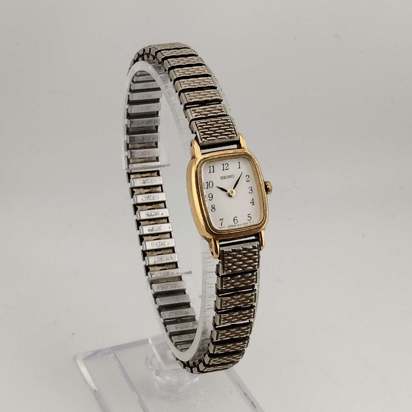 I Like Mikes Mid Century Modern Watches Seiko Women's Gold Tone Petite Watch, White Rounded Corner Rectangular Dial, Stretch Strap