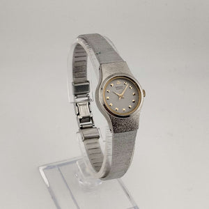 I Like Mikes Mid Century Modern Watches Seiko Women's Quartz Silver Tone Watch, Round Grey Face, Gold Jewel Details, Bracelet Strap