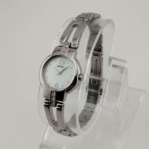 I Like Mikes Mid Century Modern Watches Seiko Women's Round Silver Tone Watch, Circular Mother of Pearl Dial, Bracelet Strap