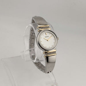 I Like Mikes Mid Century Modern Watches Seiko Women's Silver Tone Watch, Gold Tone Details, Round White Face, Jewel Bezel Details, Bracelet Strap