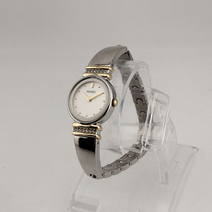 I Like Mikes Mid Century Modern Watches Seiko Women's Silver Tone Watch, Gold Tone Details, Round White Face, Jewel Bezel Details, Bracelet Strap