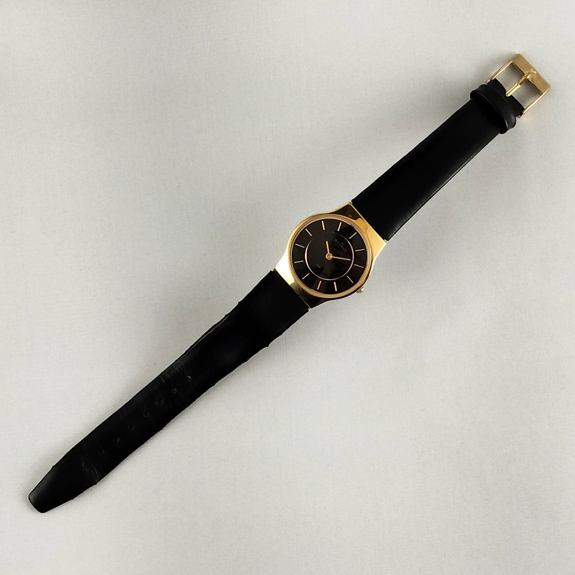 I Like Mikes Mid Century Modern Watches Skagen Unisex Stainless Steel Gold Tone Watch, Black Dial, Black Genuine Leather Strap