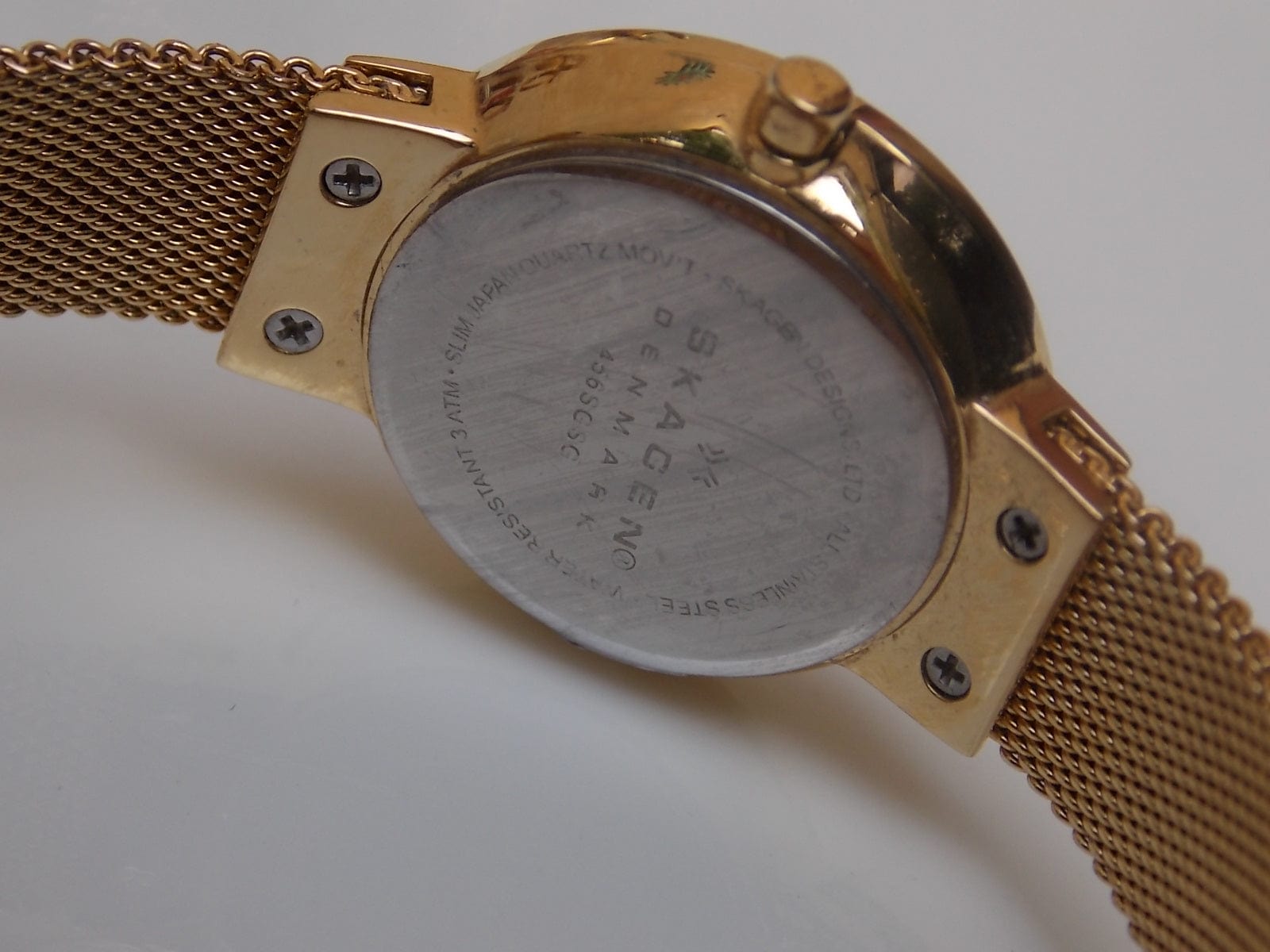 I Like Mikes Mid Century Modern Watches Skagen Women's Goldtone Round Gold Dial Jewel Number Markers Facet Cut Border Mesh Band