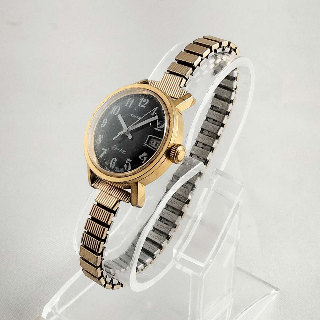 Timex Unisex Gold Tone Watch, Black Dial, Thin Stretch Strap  display picture 1