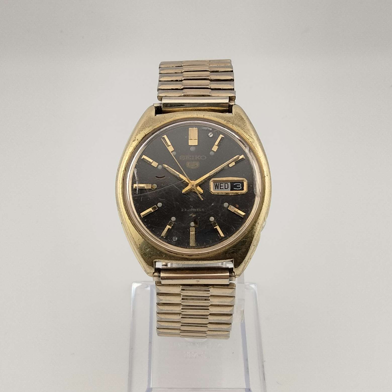 Seiko 5 Men's Gold Tone Watch, Round, Automatic, Black Face, Number Markers, Date, Bracelet Strap