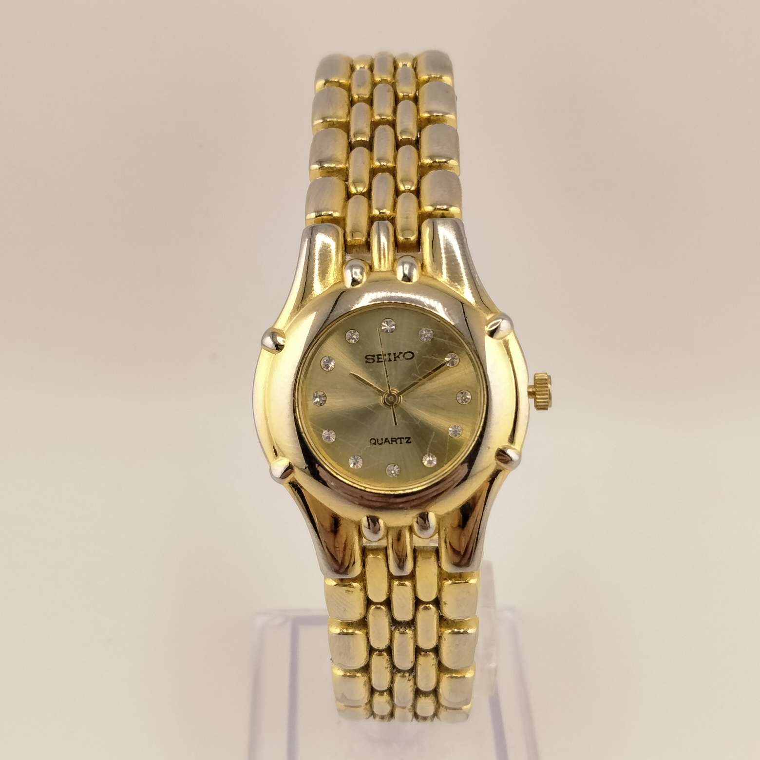 Seiko Women's Gold Tone Watch, Round Dial, Crystal Dot Hour Markers, Gold Dial, Bracelet Strap