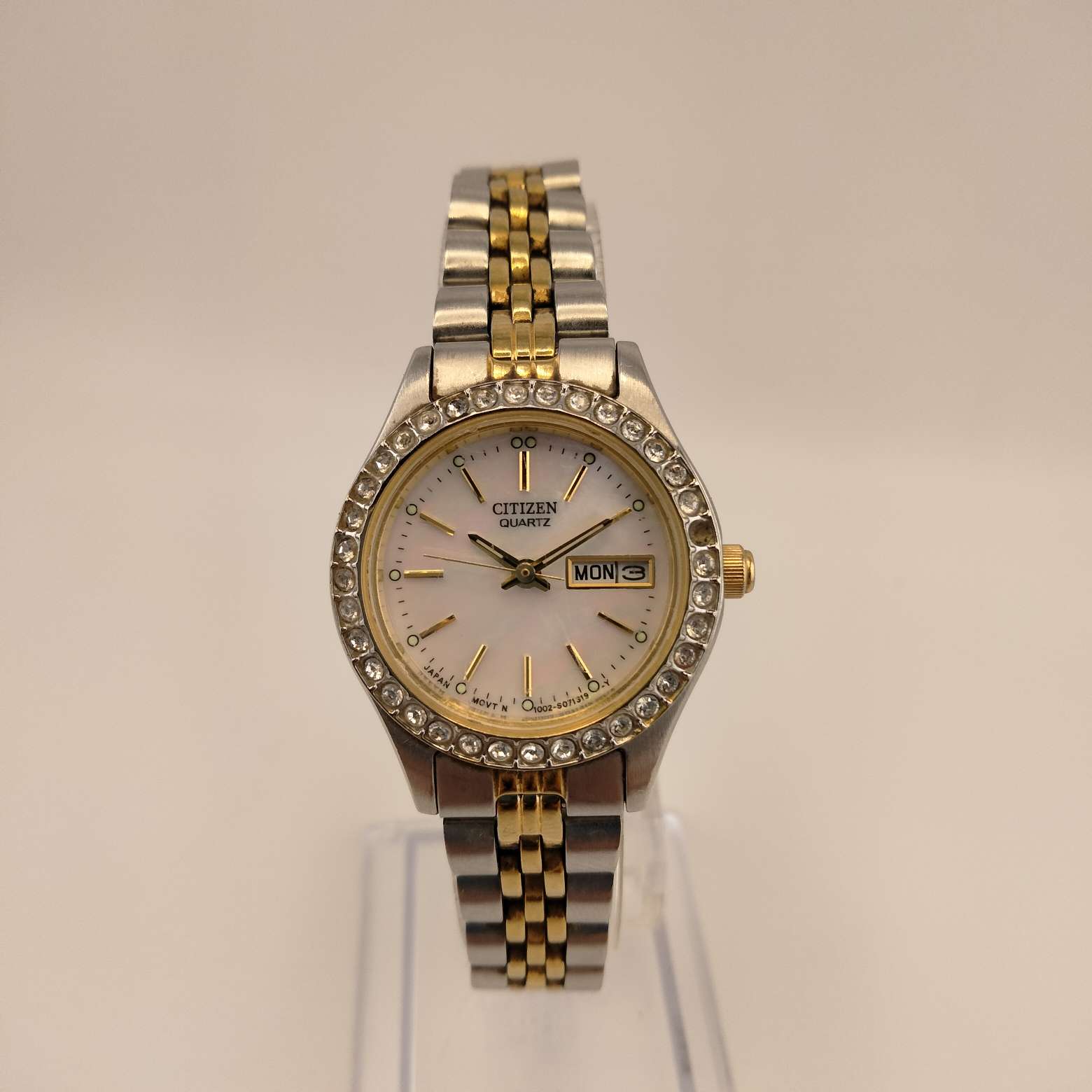 Citizen Women's Mixed Metal Round Watch,  Silver Tone Face, Mother of Pearl Dial with Gold Tone Accents, Bejeweled Bezel,  Mixed Metal Link Strap