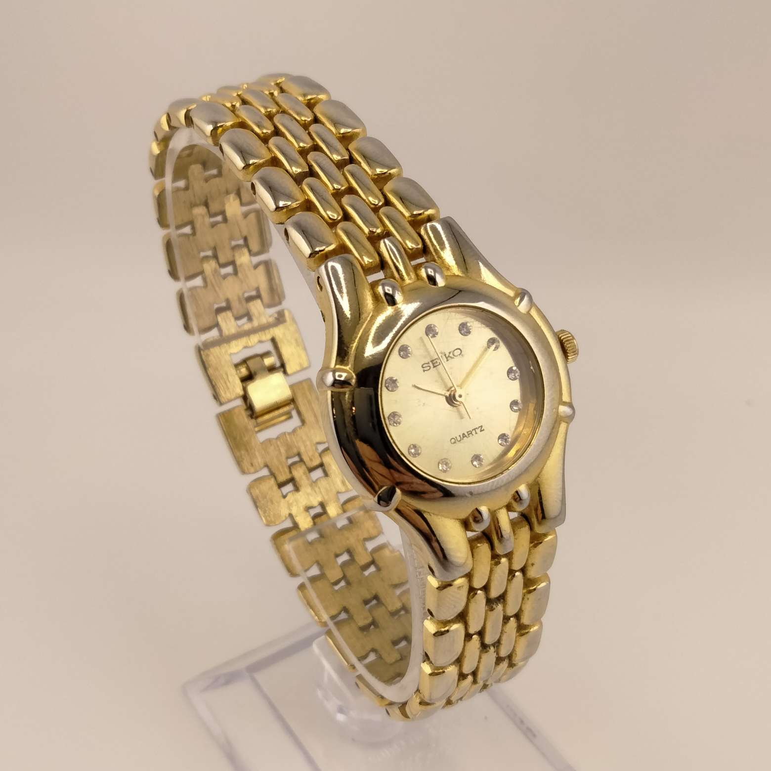 Seiko Women's Gold Tone Watch, Round Dial, Crystal Dot Hour Markers, Gold Dial, Bracelet Strap