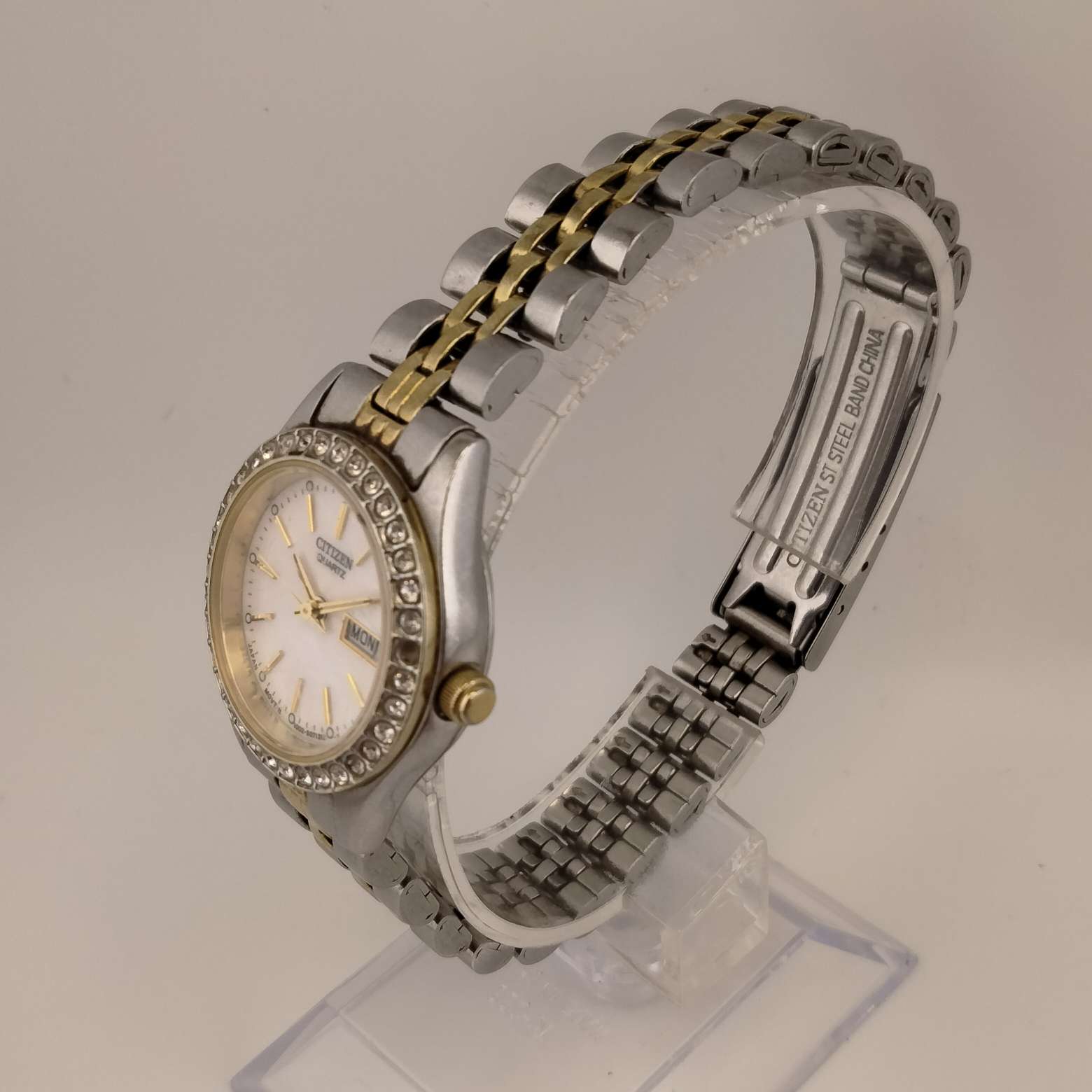 Citizen Women's Mixed Metal Round Watch,  Silver Tone Face, Mother of Pearl Dial with Gold Tone Accents, Bejeweled Bezel,  Mixed Metal Link Strap